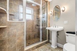 bathroom with toilet and walk in shower