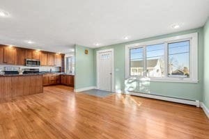 kitchen featuring light hardwood / wood-style floors and baseboard heating