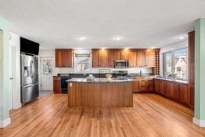 kitchen featuring a center island, light wood-type flooring, and appliances with stainless steel finishes