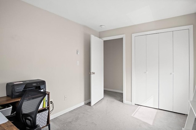 office area featuring baseboards and carpet