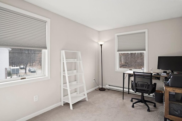 office with a baseboard radiator, baseboards, and light carpet