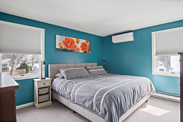 carpeted bedroom with a baseboard radiator, multiple windows, baseboards, and a wall unit AC