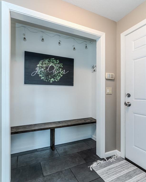 mudroom featuring baseboards