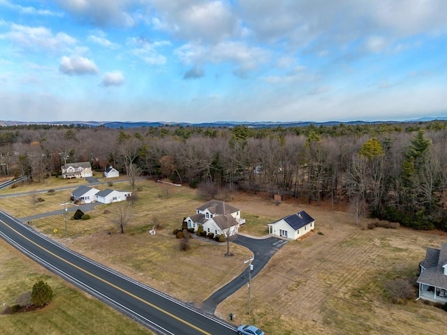view from above of property featuring a heavily wooded area