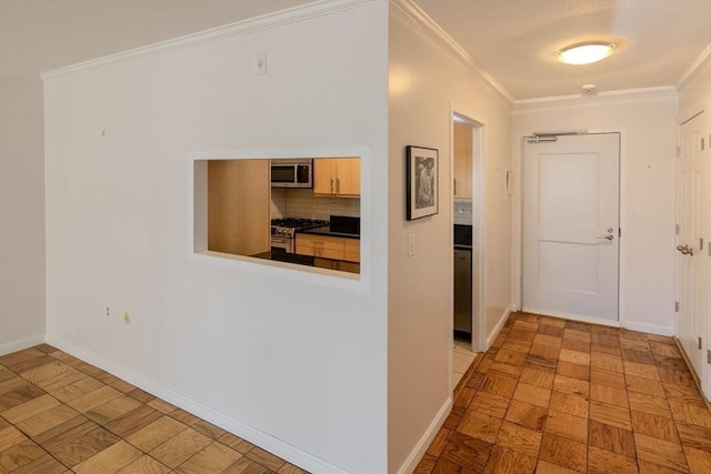 corridor featuring baseboards and crown molding