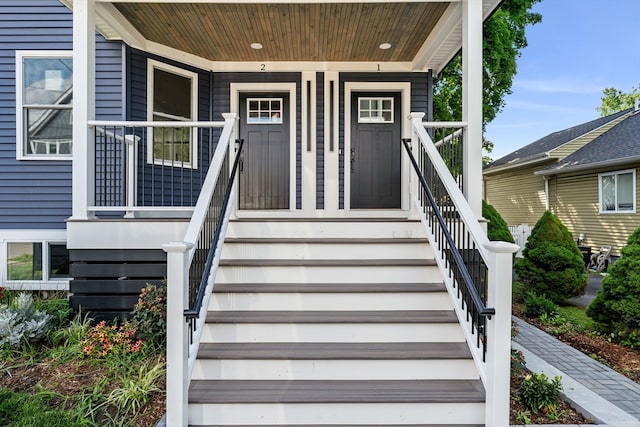 view of exterior entry with covered porch