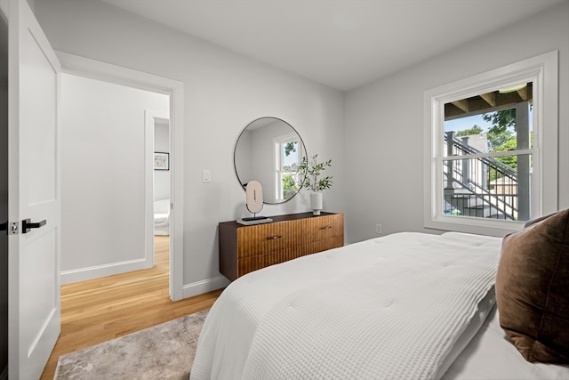 bedroom with hardwood / wood-style floors