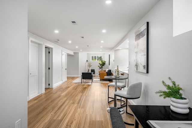 hallway with light wood-type flooring