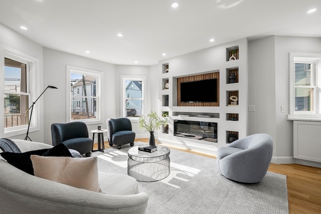 living room with light hardwood / wood-style flooring and plenty of natural light