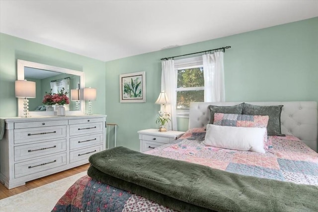 bedroom with light hardwood / wood-style floors