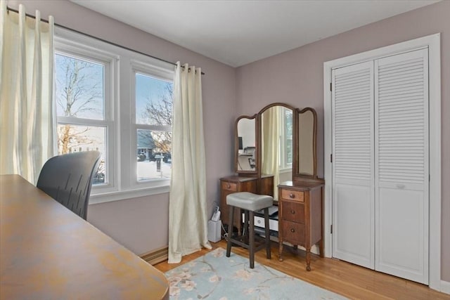 office with light hardwood / wood-style flooring