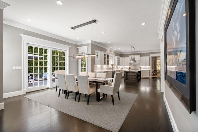 dining area with ornamental molding and dark wood-type flooring