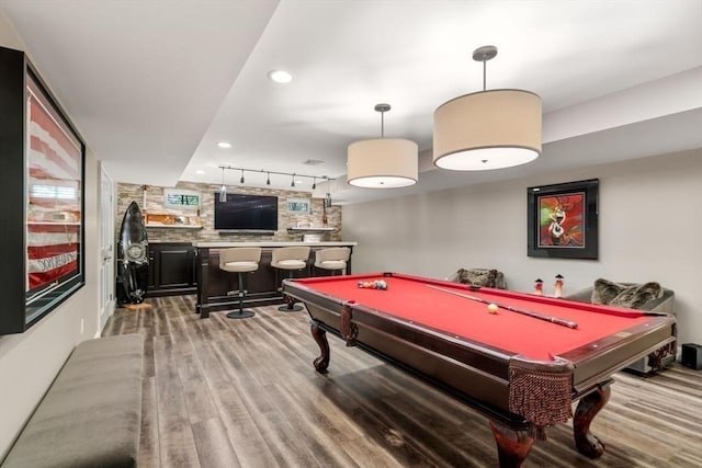 rec room featuring hardwood / wood-style flooring, pool table, rail lighting, and indoor bar