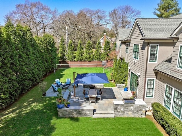 exterior space featuring an outdoor hangout area and a patio