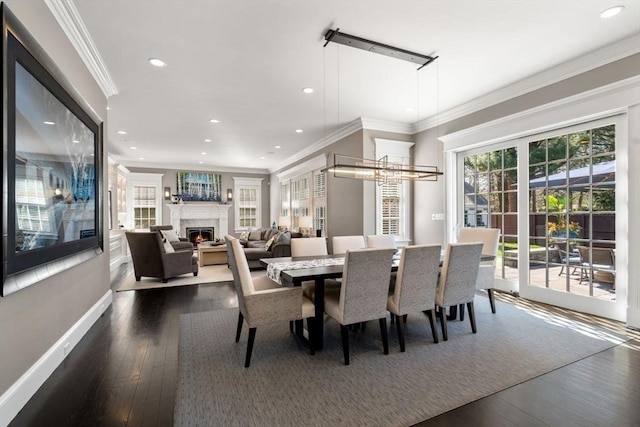 dining space with dark hardwood / wood-style flooring and ornamental molding