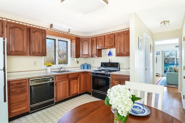 12 Taunton Ave, Marion, MA 02738 - kitchen with dishwasher, range with gas stovetop, a sink, and plenty of natural light