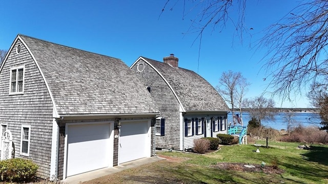 12 Taunton Ave, Marion, MA 02738 - view of side of home featuring a yard, a chimney, and a garage