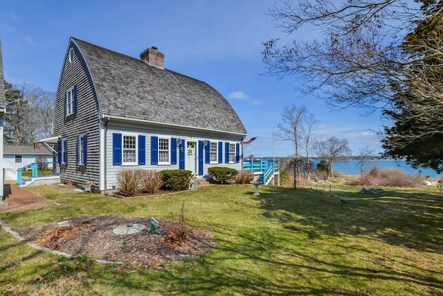 12 Taunton Ave, Marion, MA 02738 - view of front of house featuring a front lawn and a chimney