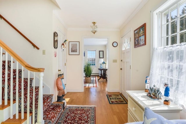 12 Taunton Ave, Marion, MA 02738 - foyer entrance with light wood finished floors, ornamental molding, and stairway
