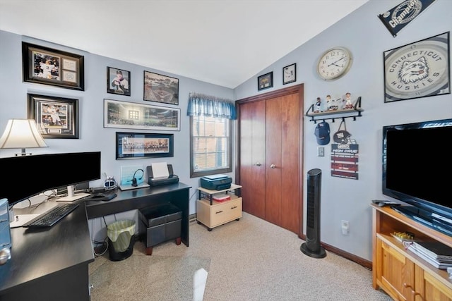 office featuring carpet floors, baseboards, and vaulted ceiling