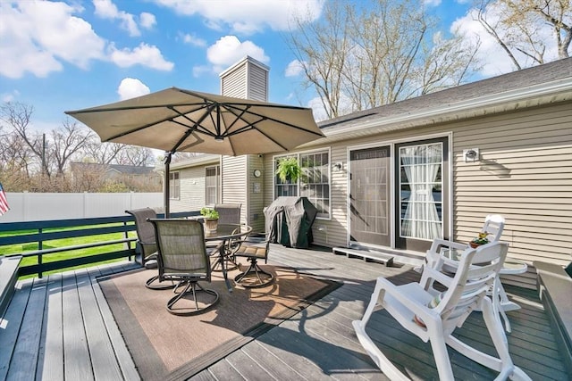 deck featuring fence and outdoor dining area
