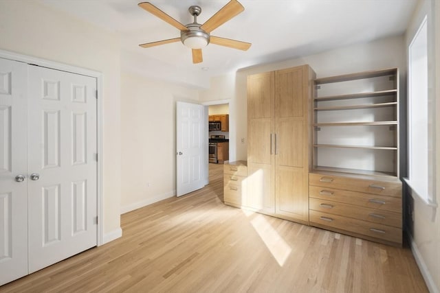 unfurnished bedroom featuring baseboards, a closet, and light wood-style flooring