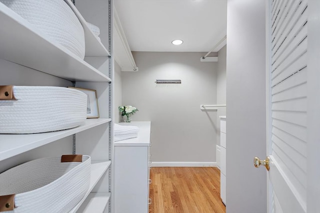 walk in closet featuring light wood-style floors