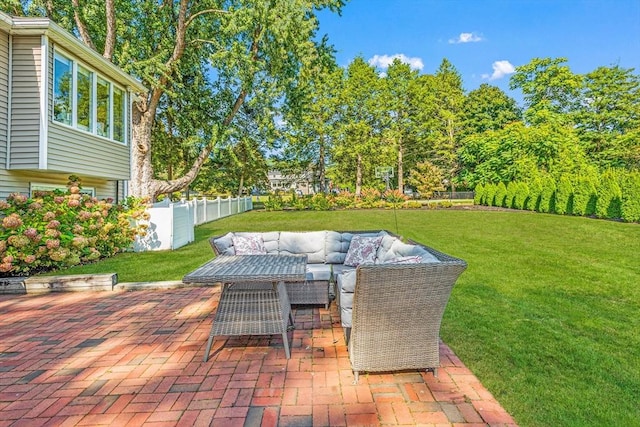 view of patio / terrace with outdoor lounge area and fence