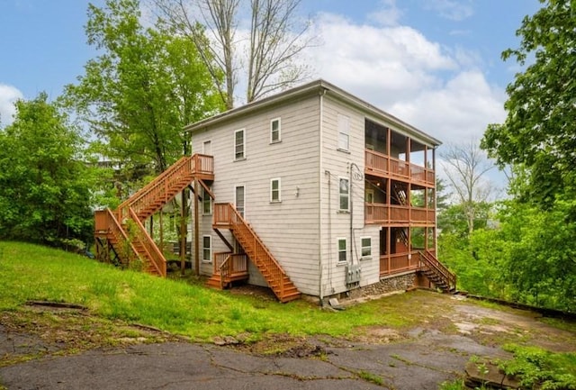 127 Cliff St, Southbridge, MA 01550 - rear view of house with stairs, a balcony, and a yard