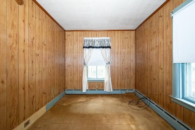 127 Cliff St, Southbridge, MA 01550 - spare room with healthy amount of natural light, carpet, a baseboard heating unit, baseboard heating, and wood walls
