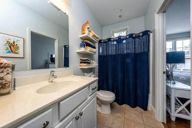 full bath with toilet, a shower with curtain, vanity, and tile patterned floors