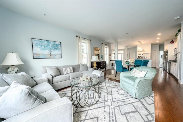 living area with recessed lighting and hardwood / wood-style flooring