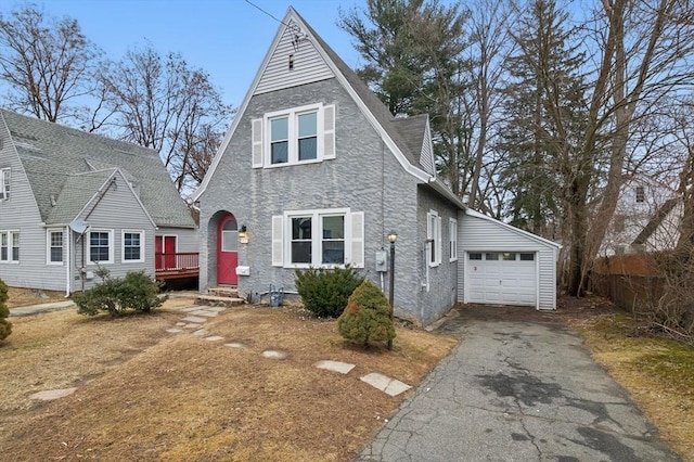 view of front of property with a garage and aphalt driveway