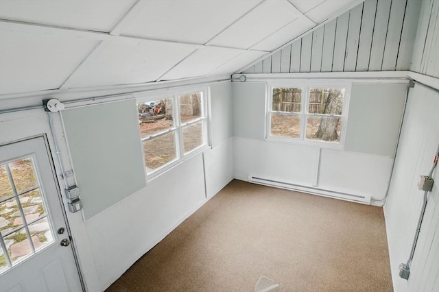 unfurnished sunroom with lofted ceiling and baseboard heating