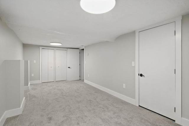 unfurnished bedroom with carpet and baseboards