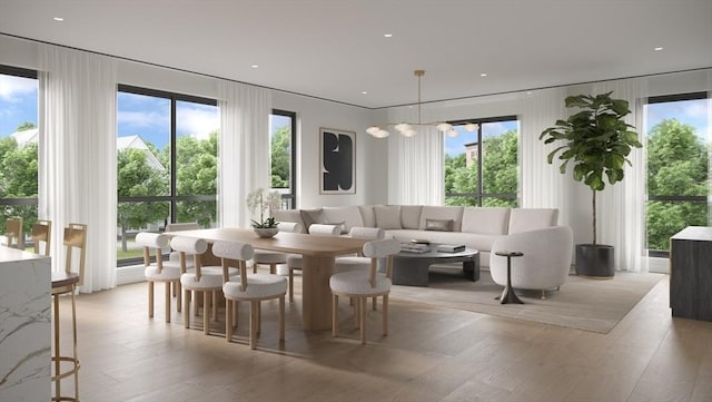 dining room featuring light wood-type flooring and recessed lighting