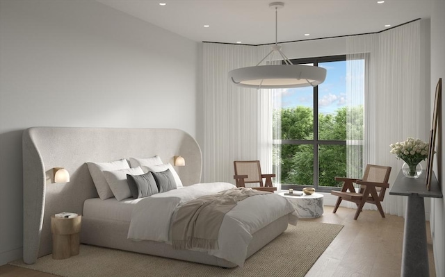 bedroom featuring light wood-type flooring and recessed lighting