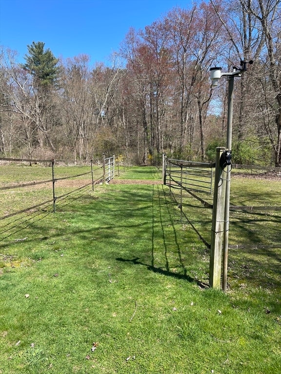 view of yard with a rural view