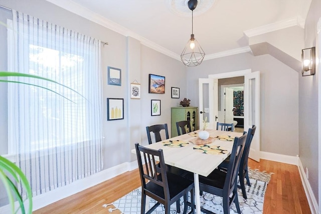 253 Front St, Weymouth, MA 02188 - dining space with light wood finished floors, baseboards, and ornamental molding