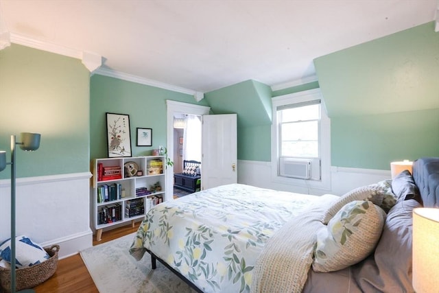253 Front St, Weymouth, MA 02188 - bedroom featuring wood finished floors, ornamental molding, cooling unit, and wainscoting