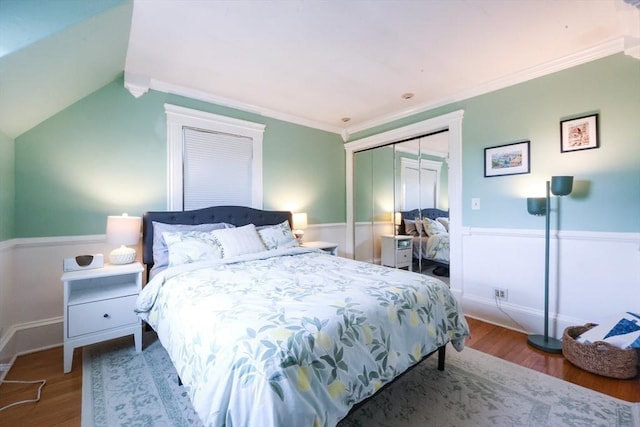 253 Front St, Weymouth, MA 02188 - bedroom featuring wood finished floors, a closet, wainscoting, crown molding, and vaulted ceiling
