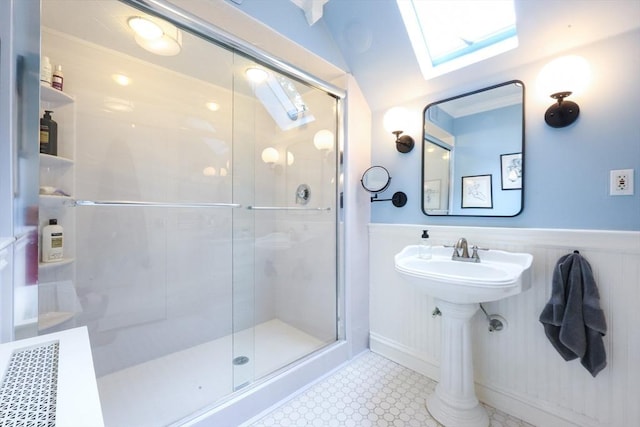 253 Front St, Weymouth, MA 02188 - bathroom featuring a wainscoted wall, a shower stall, and a skylight
