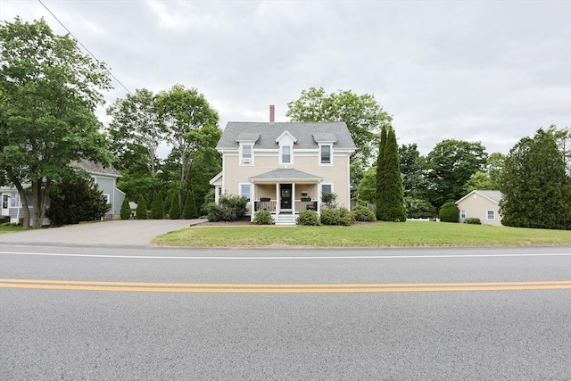 253 Front St, Weymouth, MA 02188 - view of front facade featuring a front lawn, a chimney, and covered porch