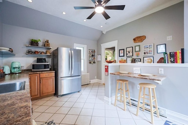 253 Front St, Weymouth, MA 02188 - kitchen featuring appliances with stainless steel finishes, radiator, brown cabinetry, open shelves, and ceiling fan