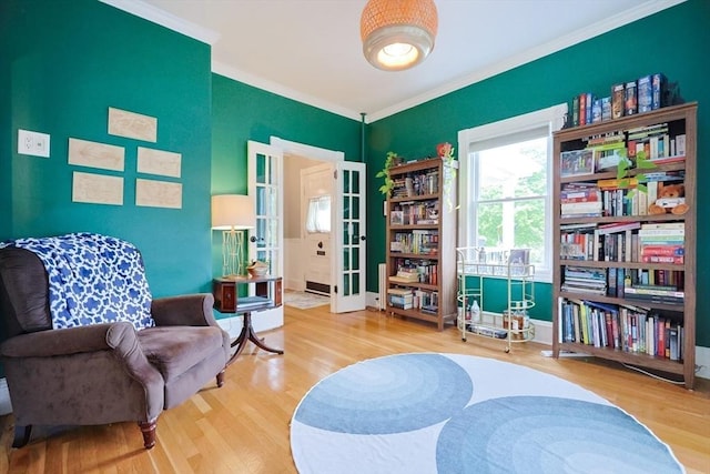 253 Front St, Weymouth, MA 02188 - living area with wood finished floors, ornamental molding, and french doors