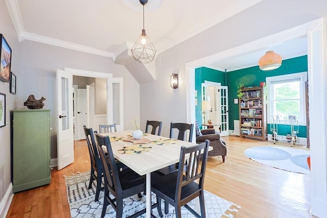 253 Front St, Weymouth, MA 02188 - dining room featuring light wood finished floors, ornamental molding, and french doors