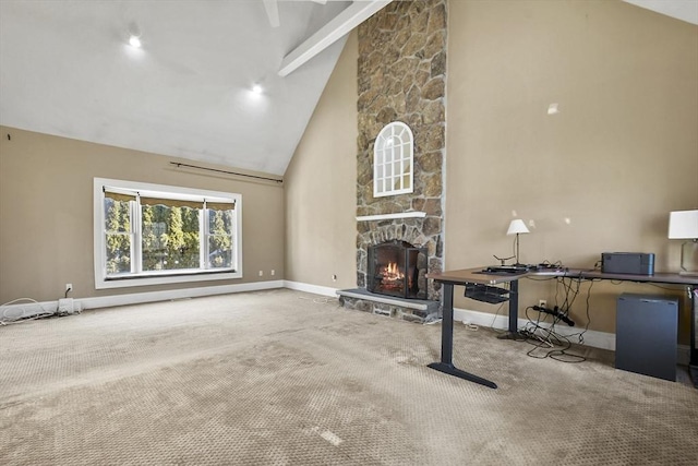 unfurnished living room featuring baseboards, carpet, a stone fireplace, and high vaulted ceiling