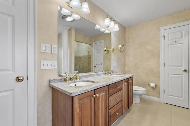 full bathroom featuring tile patterned flooring, toilet, double vanity, a stall shower, and a sink