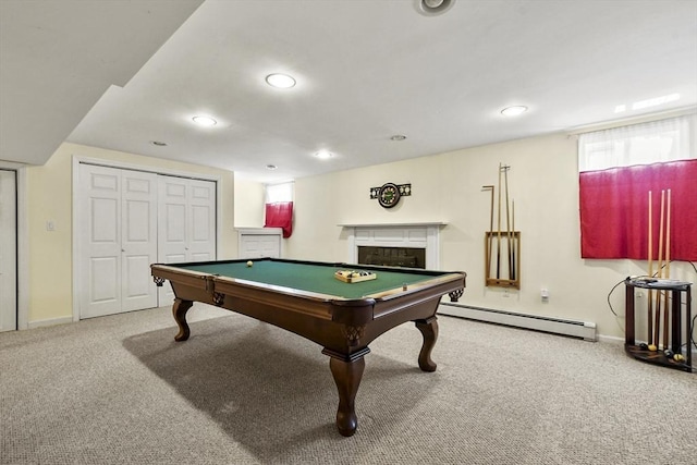 recreation room with carpet flooring, recessed lighting, a fireplace, and a baseboard heating unit