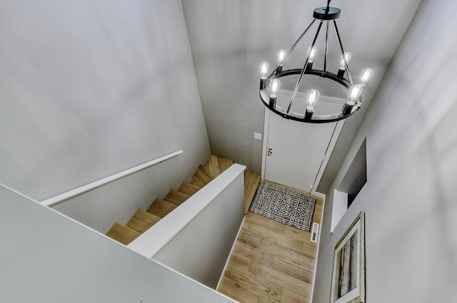32 Sandy Reach Unit 32, Falmouth, MA 02536 - staircase with an inviting chandelier and wood finished floors
